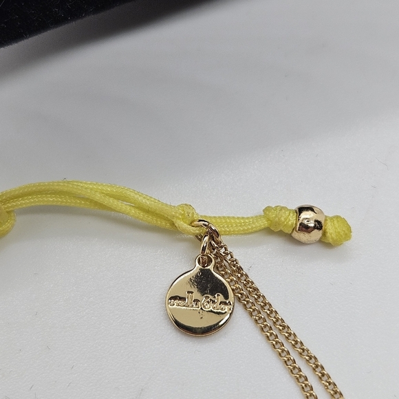 Stella & Dot gold tone and yellow drawstring bracelet with arrow charm - Picture 3 of 4